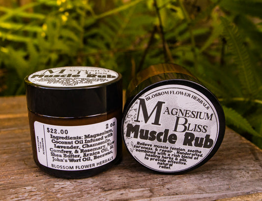 Two small jars of Blossom Flower Herbs Magnesium Bliss Muscle Rub .