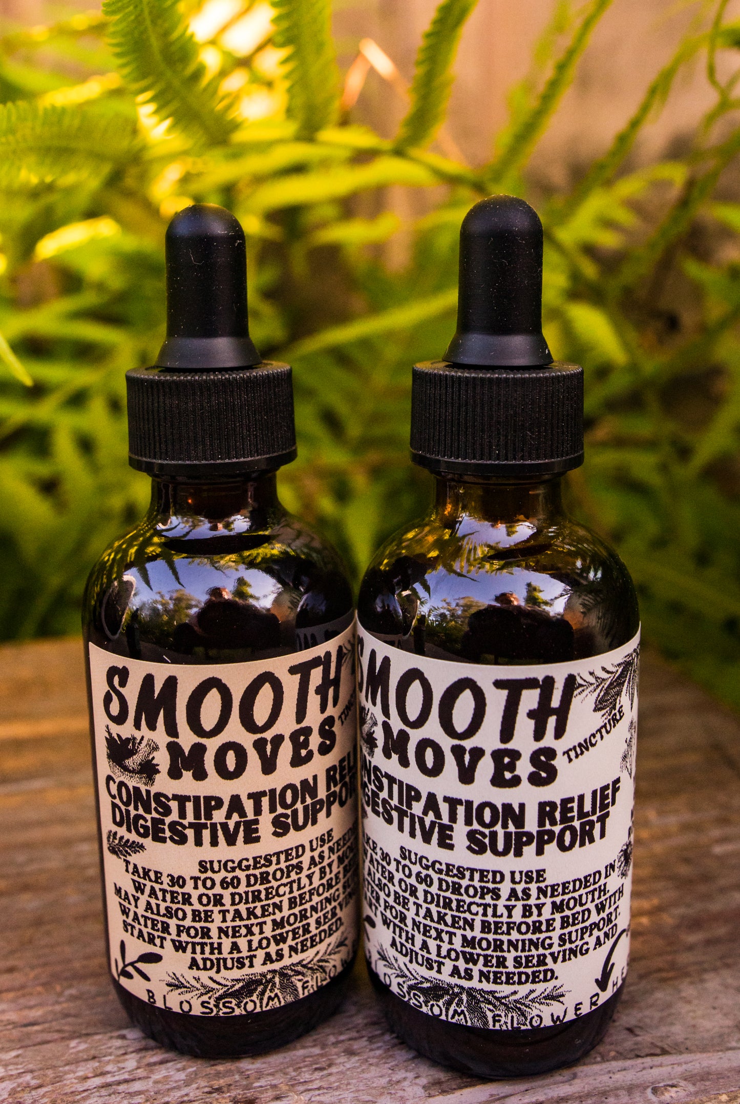 Smooth Moves herbal extract by Blossom Flower Herbals in a 2 oz amber glass bottle for digestive support.