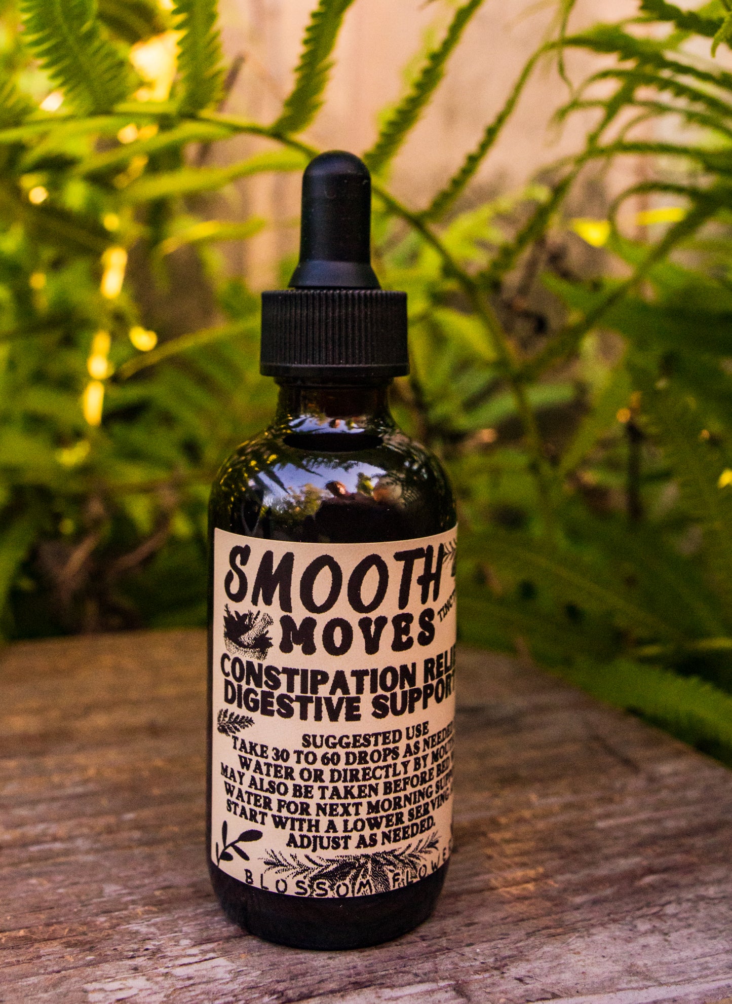 Smooth Moves herbal extract by Blossom Flower Herbals in a 2 oz amber glass bottle for digestive support.